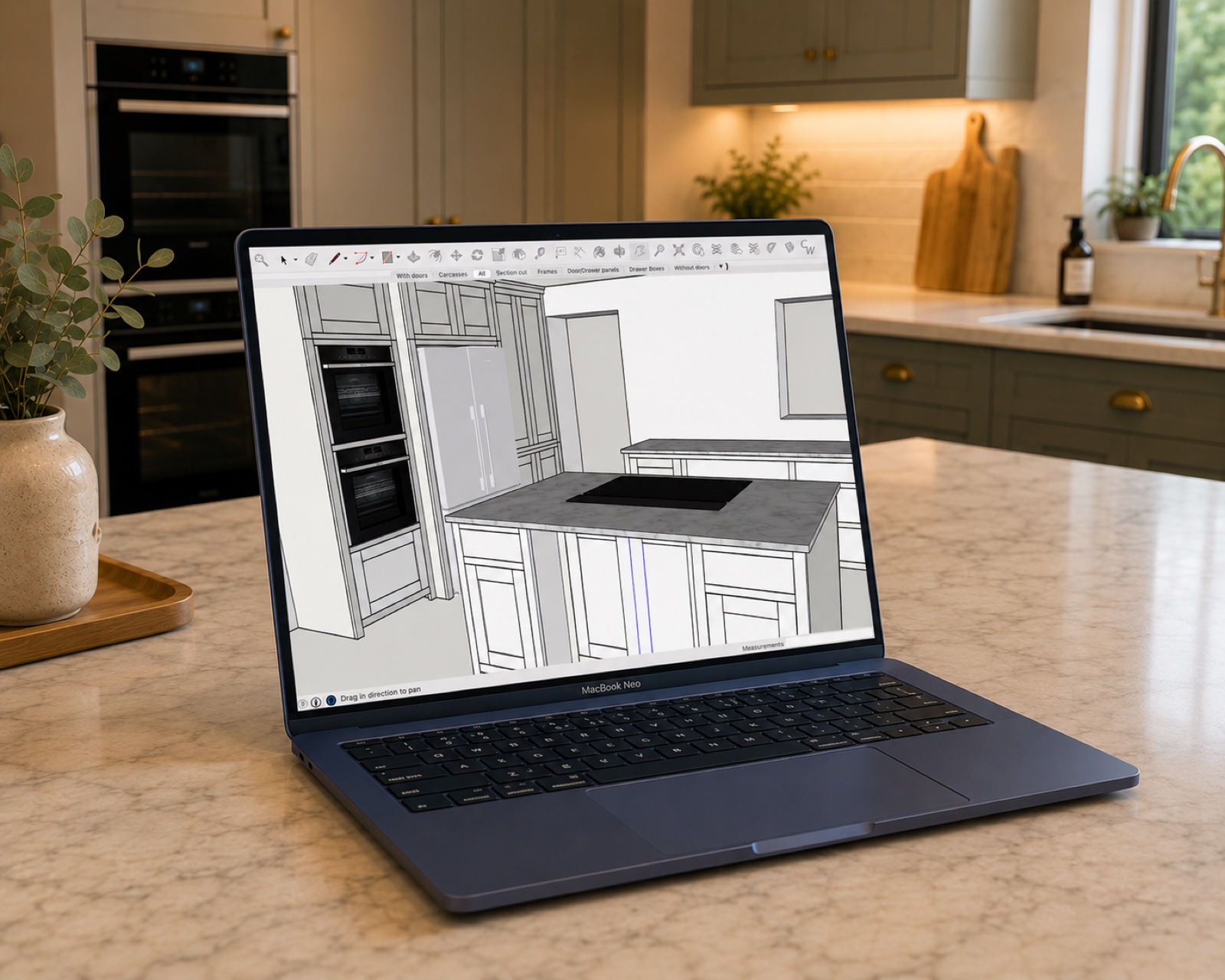 3D SketchUp design of a bespoke shaker kitchen shown on a laptop