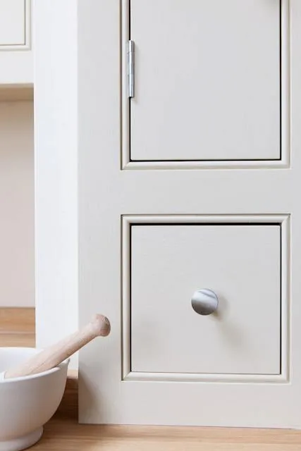 Bespoke shaker kitchen drawer detail with silver knob